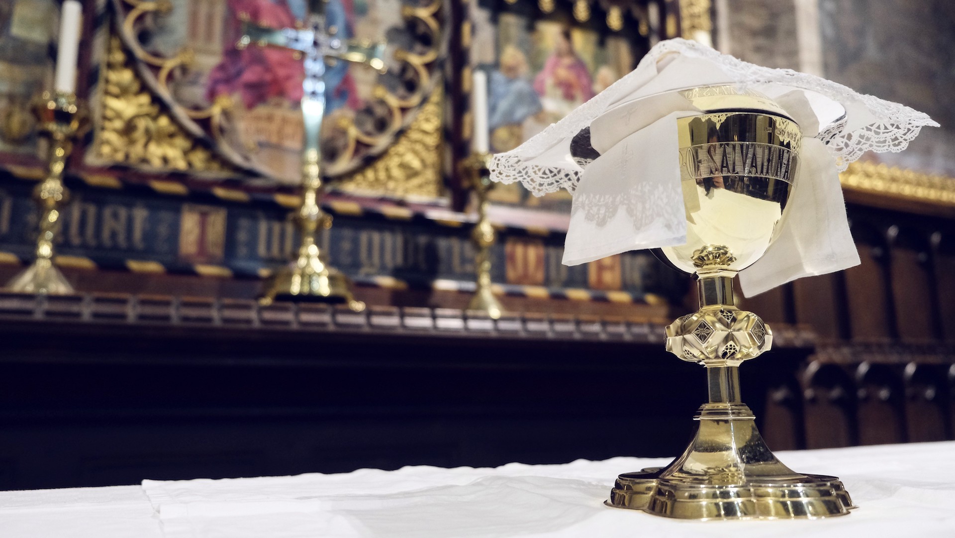 A gold chalice on an altar